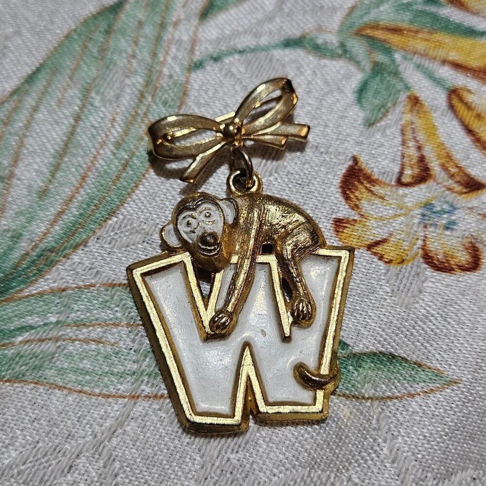 vintage W monkey gold tone bow brooch
